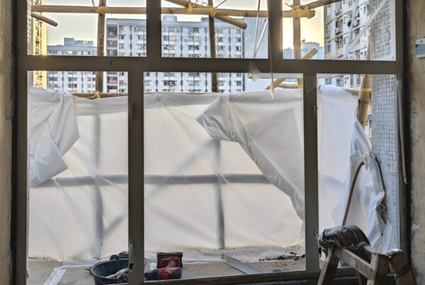 Professional new aluminium window frame installation with safety scaffolding, fully compliant with Buildings Department standards.